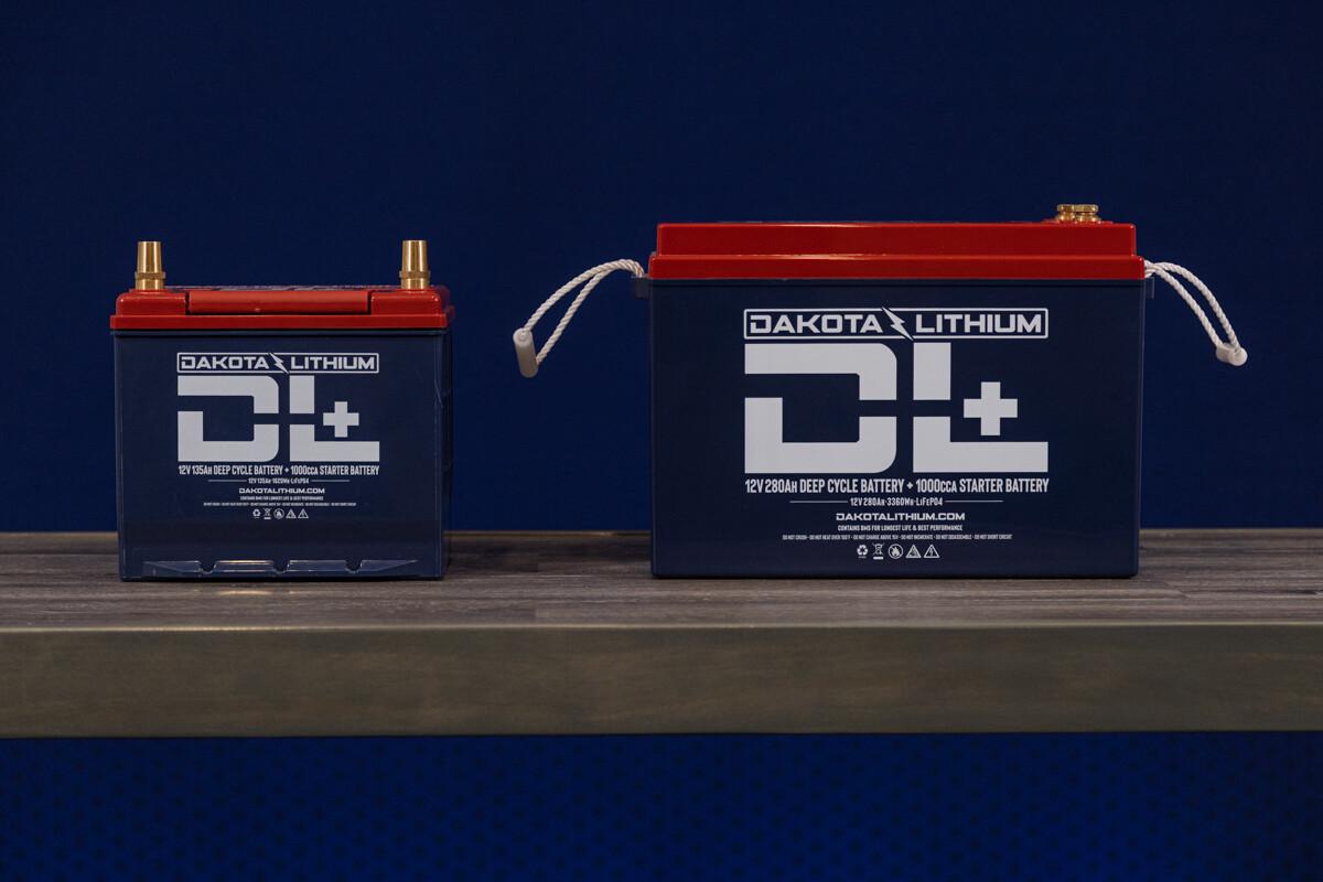 Deep cycle Dakota Lithium battery next to an Automotive Lithium car battery